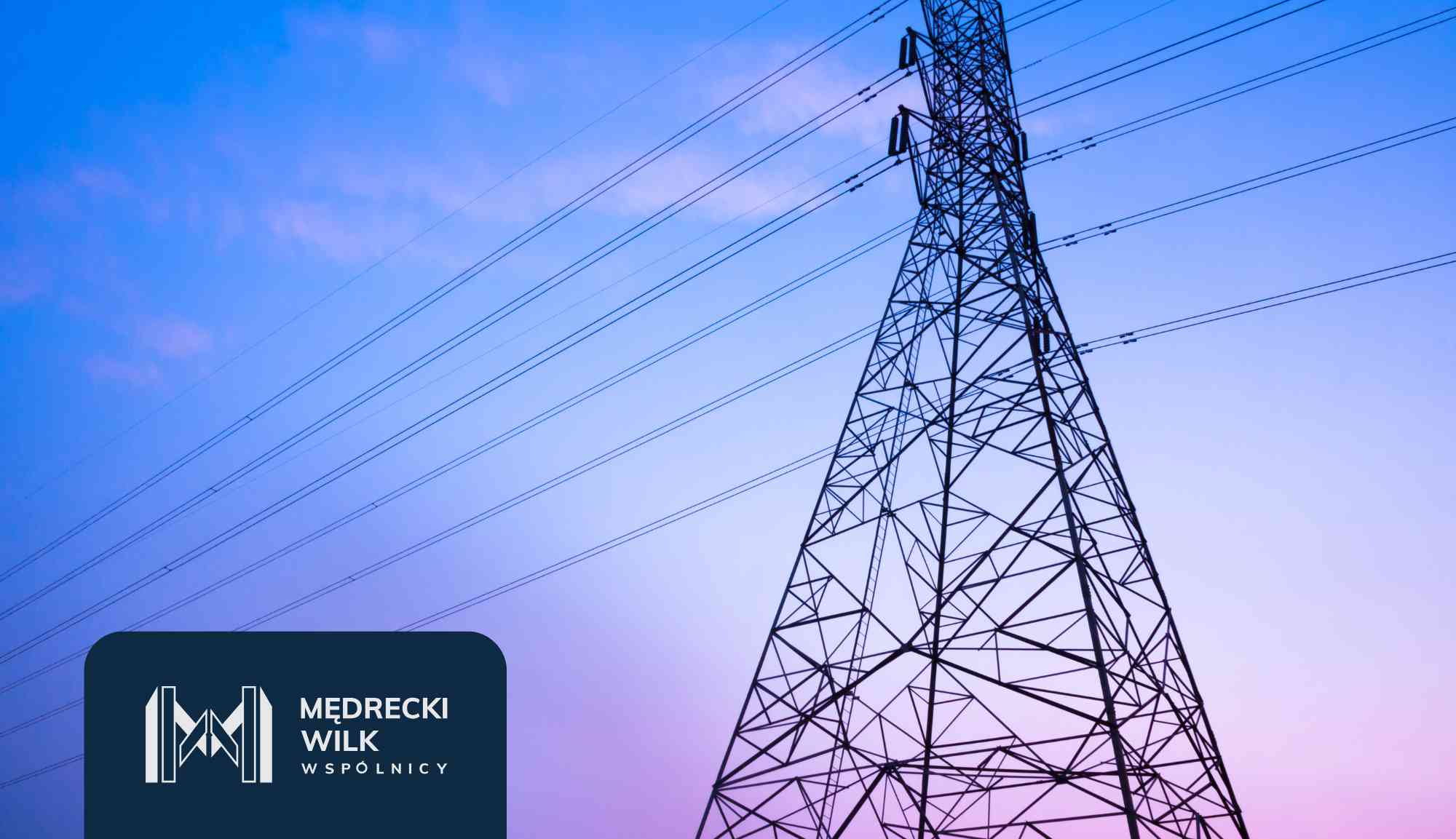 Power lines and tall transmission towers silhouetted against a colorful sunset sky, with a dark blue overlay and company logo in the lower-left corner reading 'Medrecki Wilk Wspólnicy'